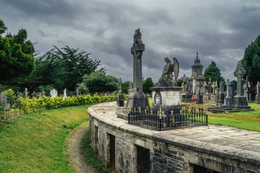 Dublin, Ireland, August 2019 Round mausoleum or crypts with ancient graves and tombstones in Glasnevin Cemetery