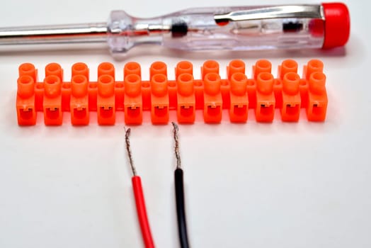 terminal block with cable, pliers and screwdriver