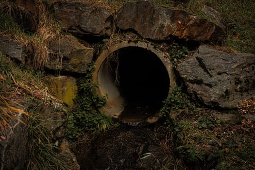 Dark pipe in brick wall
