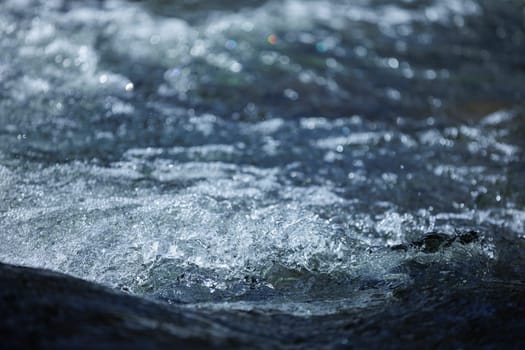 Flowing blue fresh water in river
