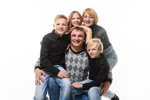 Children and mom hug happy dad, portrait of large adult family, isolated on white background