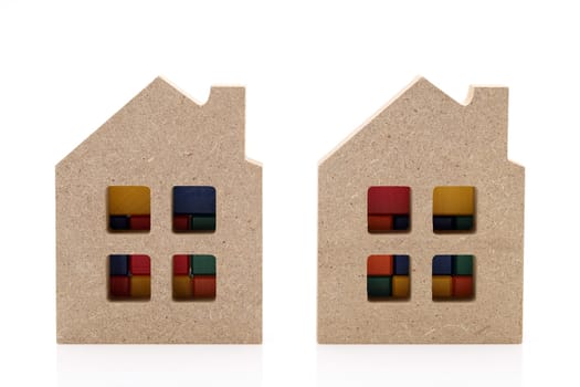 small wooden toy house isolated on white background