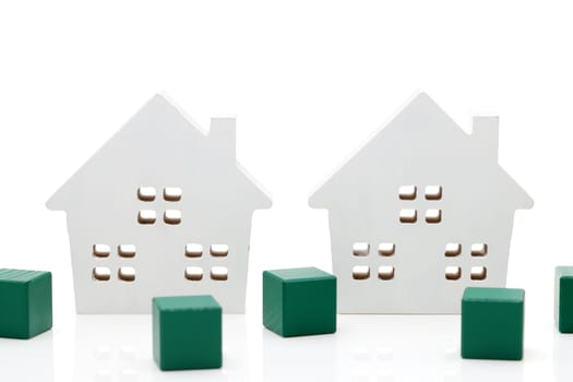 small wooden toy house isolated on white background