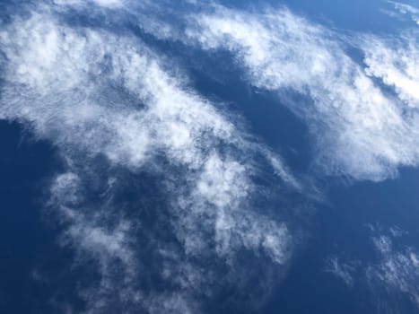 Fluffy white clouds and blue sky