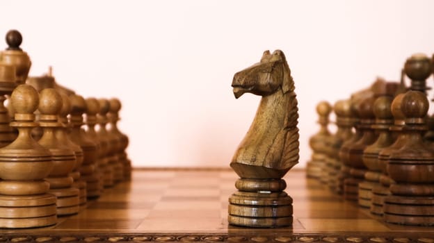 wooden chessboard with wooden brown chess pieces