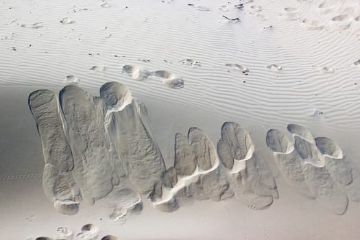 Footprints in the Sand in the Nethelands, Nature pattern background.