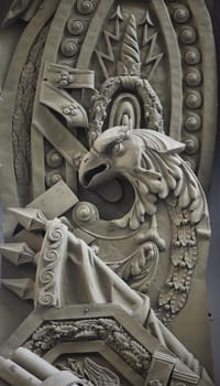 eagle on a heraldic shield, banners, laurel wreaths, a symbol of courage and valor of victory, a bas-relief