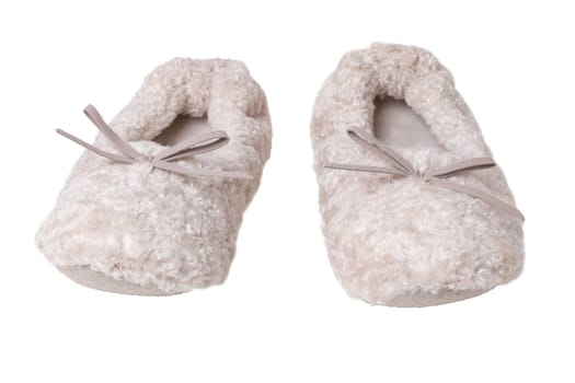 Slippers isolated. Close-up of a pair of female beige warm and soft cosy terry slippers isolated on white background.  Womans shoes.