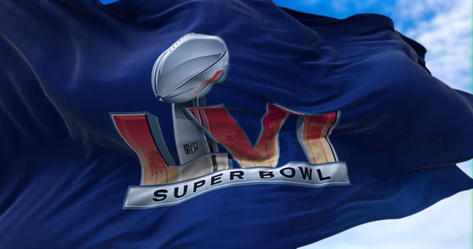 Inglewood, CA, USA, January 2022: The flag with the LVI Super Bowl logo waving in the wind. The game is scheduled to take place on February 13, 2022