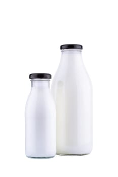 front view closeup of glass bottles of fresh milk mockup  of different sizes with black colored cap enclosure and no label  isolated on white background