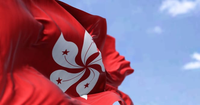 Detail of the civil flag of Hong Kong waving in the wind on a clear day. Selective focus. Hong Kong is a city and special administrative region of China
