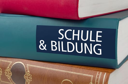 A book with the title School and Education written on the spine - Schule und Bildung (German)
