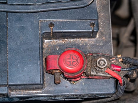 Red positive terminal with car battery wires. plus DC. Battery terminal. Red color. Electrical voltage. Automotive electrician. Car repair. Vehicle Service. Repair shop. Supply voltage. Technics.