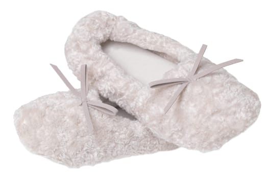 Slippers isolated. Close-up of a pair of female beige warm and soft cosy terry slippers isolated on white background.  Womans shoes.