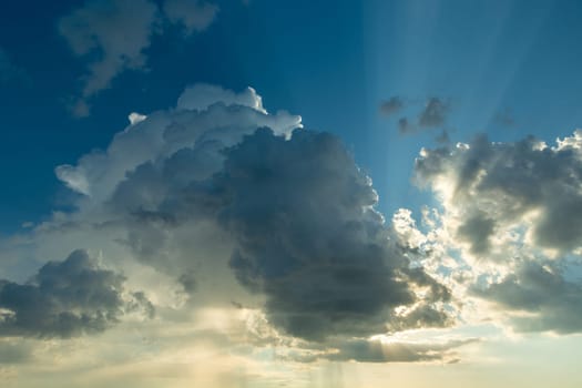 A landscape of clouds backlit by the sun, spring day