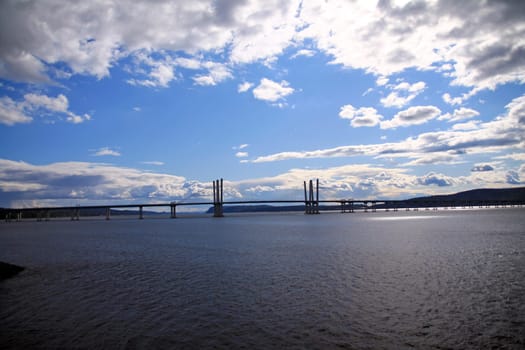 Dramatic picture of the Governator Cuomo bridge with blue sky and white clouds on the Hudson River in the New York State
