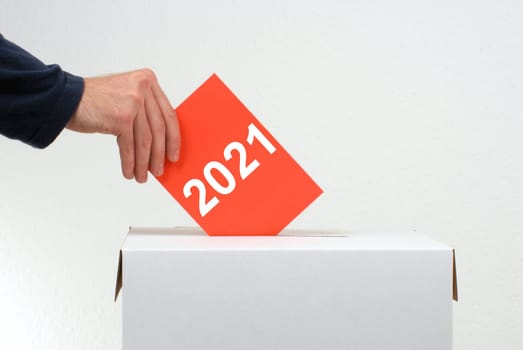 Election 2021 - Hand with envelope and ballot box