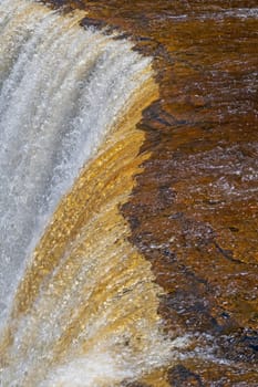 Water Plunging over the Brink on Upper Taquamenon Falls in Upper Michigan