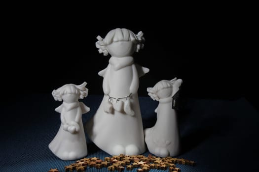 figurines white angels three small in female form angel still life