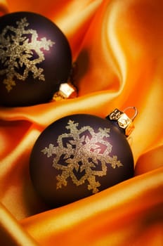 Christmas ornament on yellow silk
