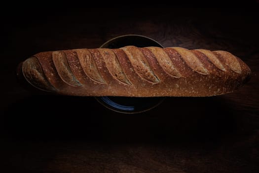 Homemade french bread baguette on wooden backround