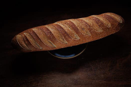 Homemade french bread baguette on wooden backround