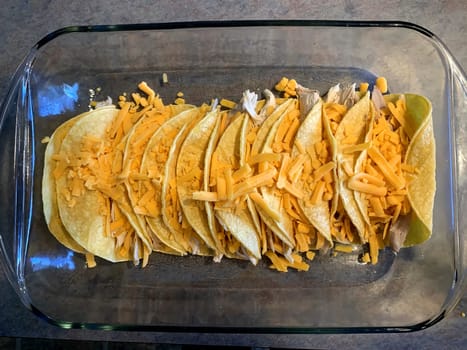 Chicken enchiladas in red chile sauce preparation