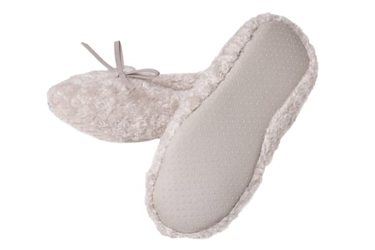 Slippers isolated. Close-up of a pair of female beige warm and soft cosy terry slippers isolated on white background.  Womans shoes.