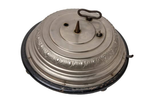 Antique original german Christmas tree stand (1902) with mechanical music box with 2 Christmas carols and turning mechanism for the Christmas tree. Clipping path. Isolated on white.