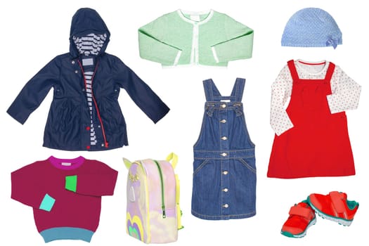 Collage set of little girl spring clothing isolated on a white background. The collection of a stylish blue down jacket, a sweater, a jeans skirt, sneaker,a bag and a dress with hood. Kids autumn and winter fashion.