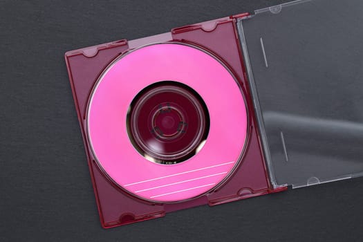 Compact disc, CD inside its plastic case on black background