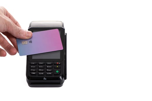 a payment terminal with a plastic card attached to it on a white isolated background close-up, copy space. High quality photo
