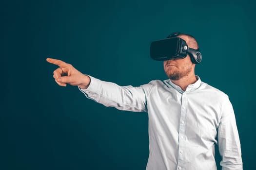 Metaverse digital cyber world technology. Businessman with VR glasses using AR augmented reality NFT, futuristic lifestyle concept