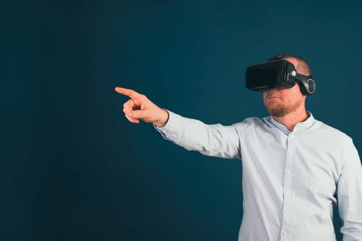 Metaverse digital cyber world technology. Businessman with VR glasses using AR augmented reality NFT, futuristic lifestyle concept
