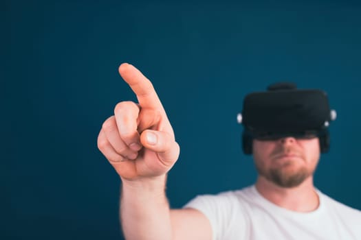 Metaverse digital cyber world technology. Man with VR glasses using AR augmented reality entertainment. NFT, game, futuristic lifestyle.