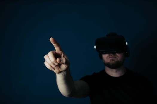Metaverse digital cyber world technology. Man with VR glasses using AR augmented reality entertainment. NFT, game, futuristic lifestyle.