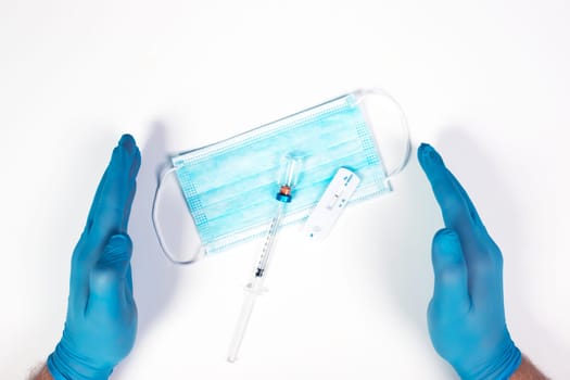 Flat lay of vaccine, test and medical mask. The concept of prevention during Coronavirus pandemic.