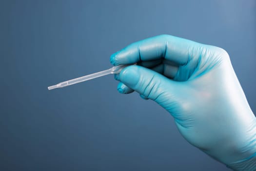 Medical healthcare holding COVID-19, coronavirus swab collection kit, wearing protective gloves