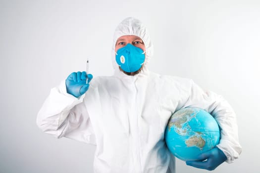 Pandemic concept, close up of scientist injecitng vaccine into the earth. Concept fight against virus.