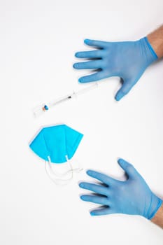 Flat lay of vaccine, test and medical mask. The concept of prevention during Coronavirus pandemic.