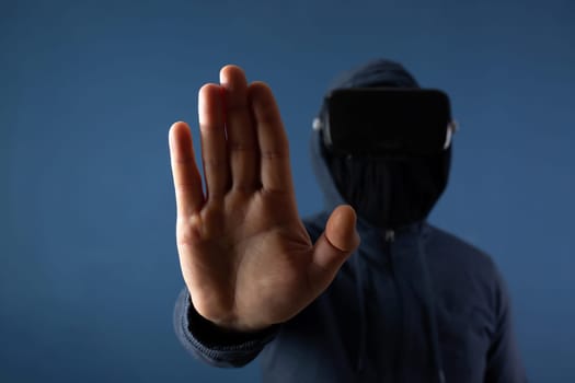 Metaverse digital cyber world technology. Man with VR glasses  playing AR augmented reality game and entertainment.NFT game futuristic lifestyle