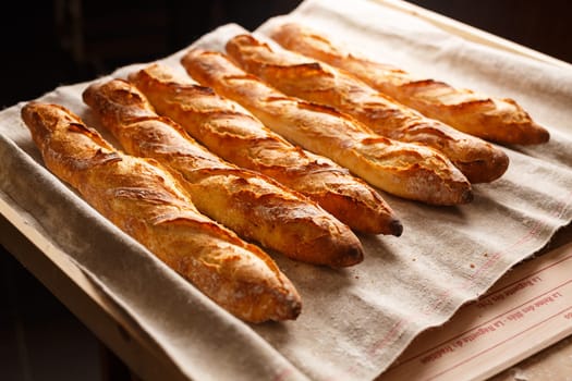 Organic baguettes in authentic bakery setting