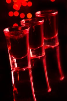 Red cocktail in shot glasses
