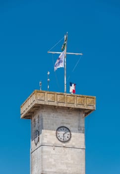 tower with clock on the port of Arsenal in Rochefort in France.