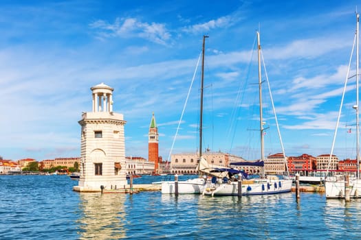 Lagoon of Venice, lighthouse and boats, beautiful italian view.