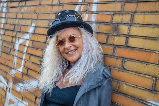 Beautiful Steam Punk Lady standing on a Brick Wall Background