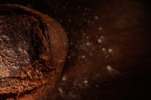 freshly baked bread on wooden table with loaf details