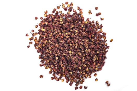 Heap of Szechuan pepper isolated over white background