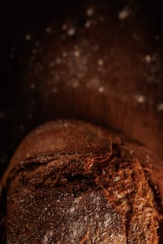 freshly baked bread on wooden table with loaf details