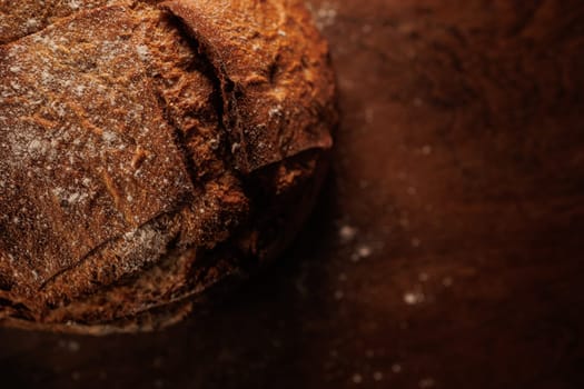 freshly baked bread on wooden table with loaf details